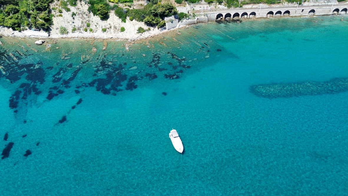 Motor yacht in turquoise Mediterranean water